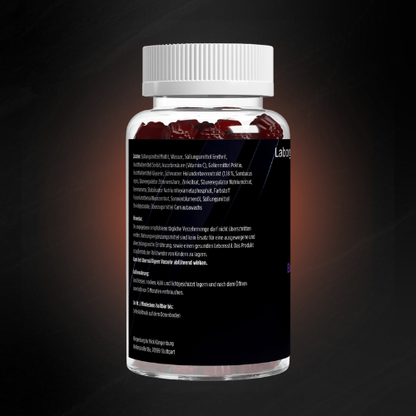 Rückseite einer transparenten Dose mit roten Holunder-Gummies, schwarzes Etikett mit Zutatenliste, Hinweisen zur Einnahme, Aufbewahrung und Mindesthaltbarkeitsangaben; modernes, minimalistisch gehaltenes Design.